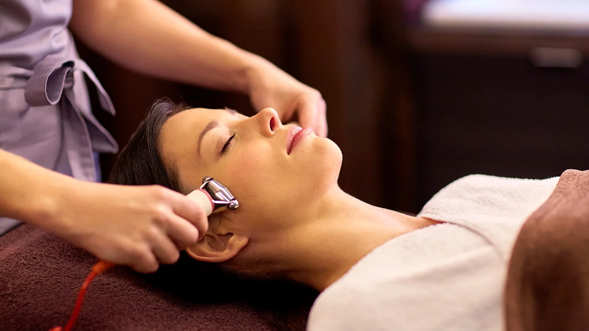 A woman on microcurrent for wrinkles treatment